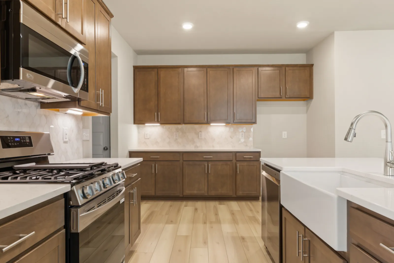 a kitchen with wooden cabinets