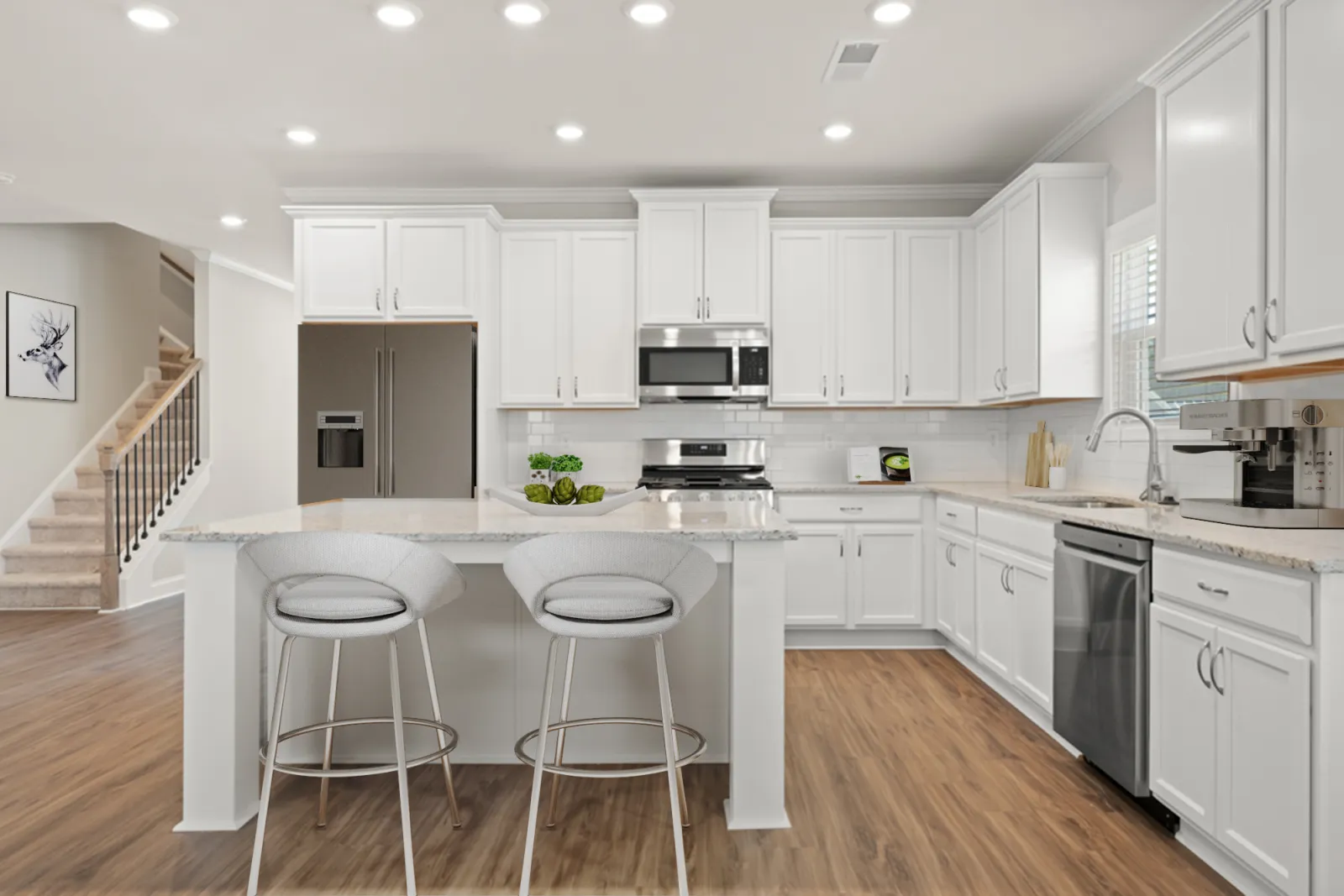 a kitchen with white cabinets