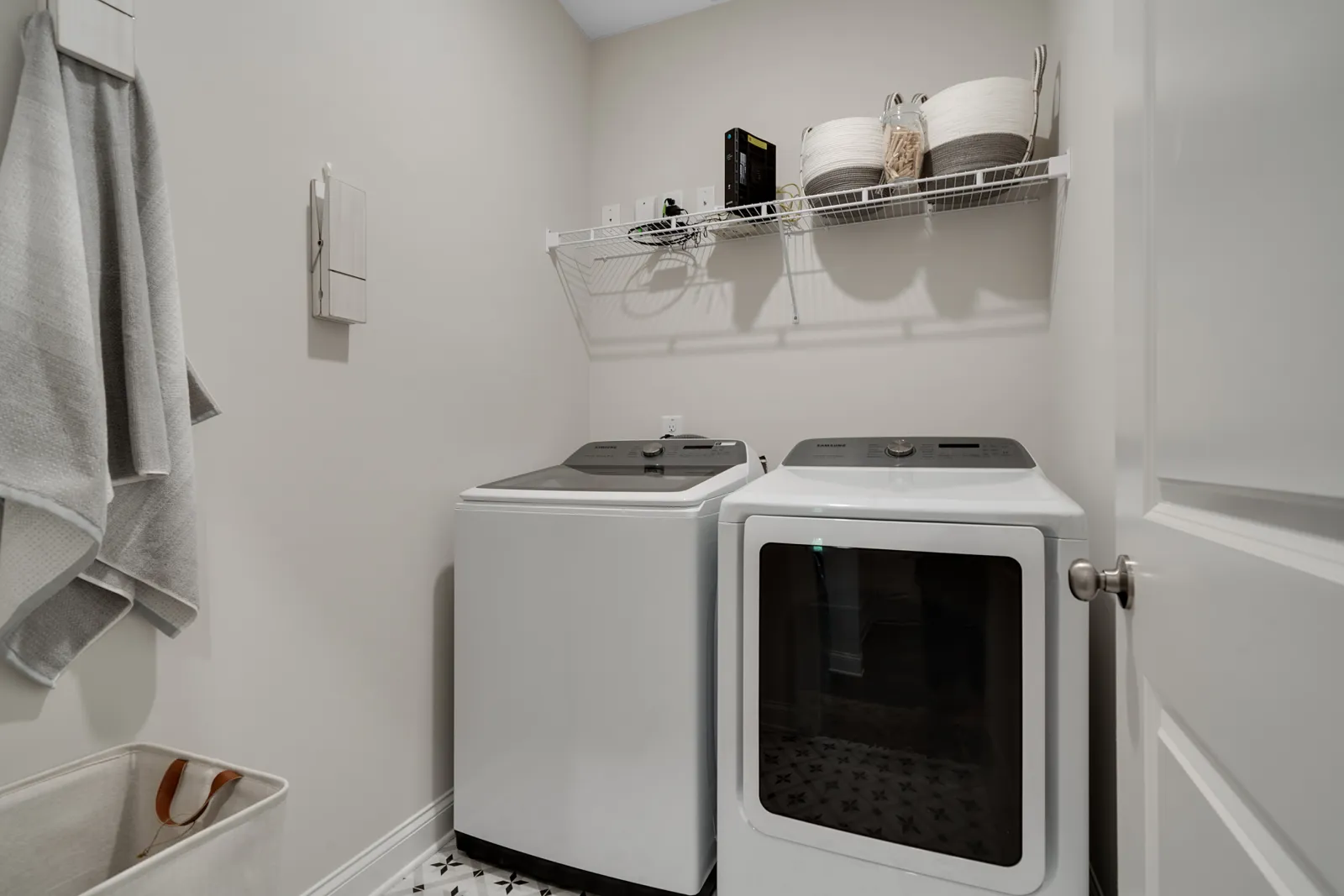 a kitchen with a white stove and white cabinets