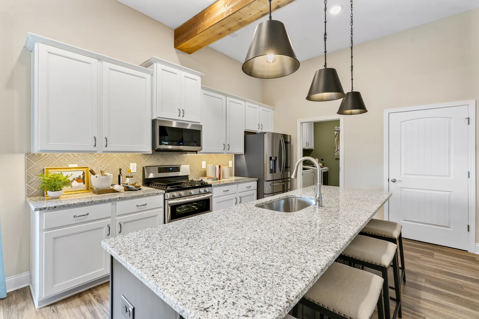 a kitchen with white cabinets