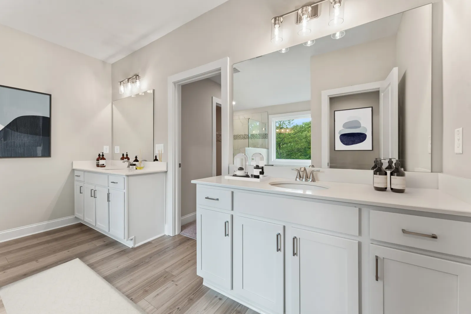 a bathroom with white cabinets