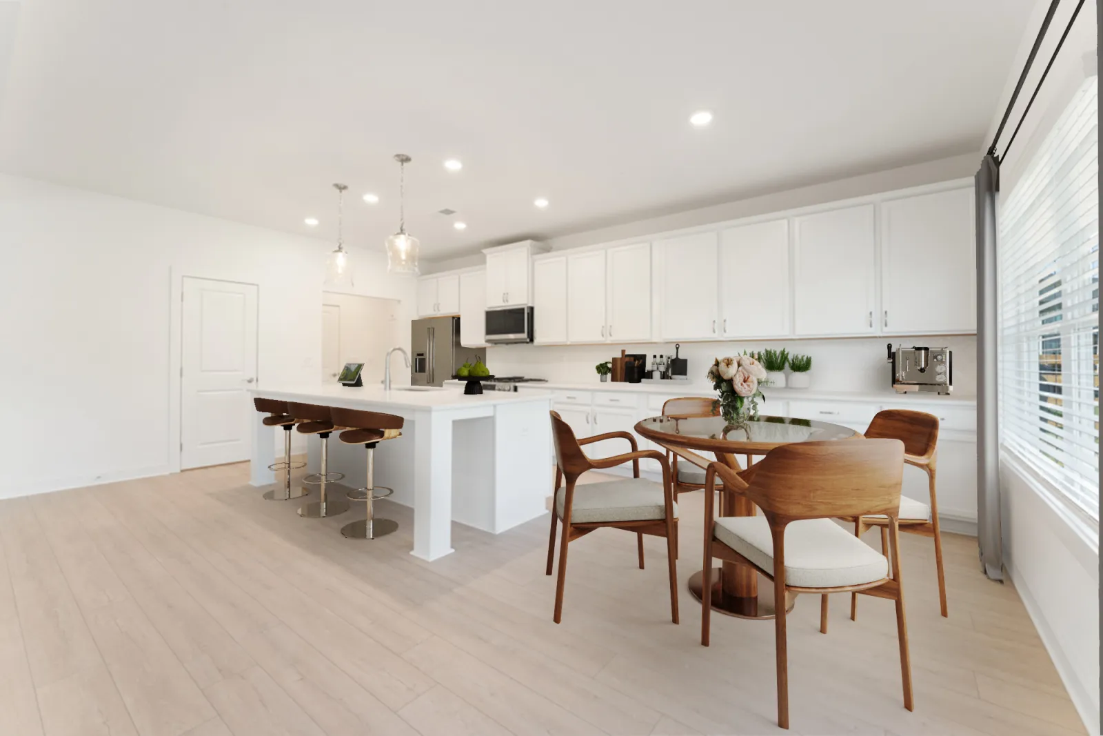 a kitchen with white cabinets