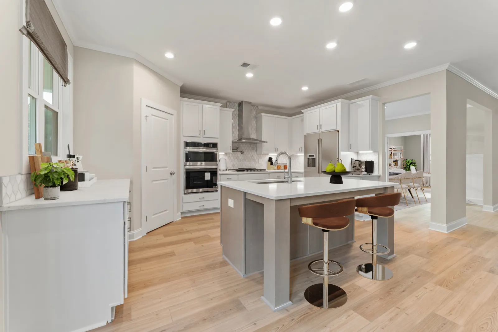 a kitchen with white cabinets