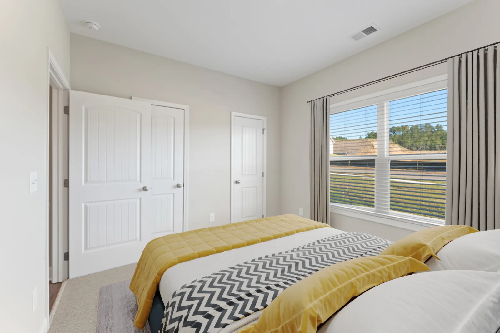 a bedroom with a large window