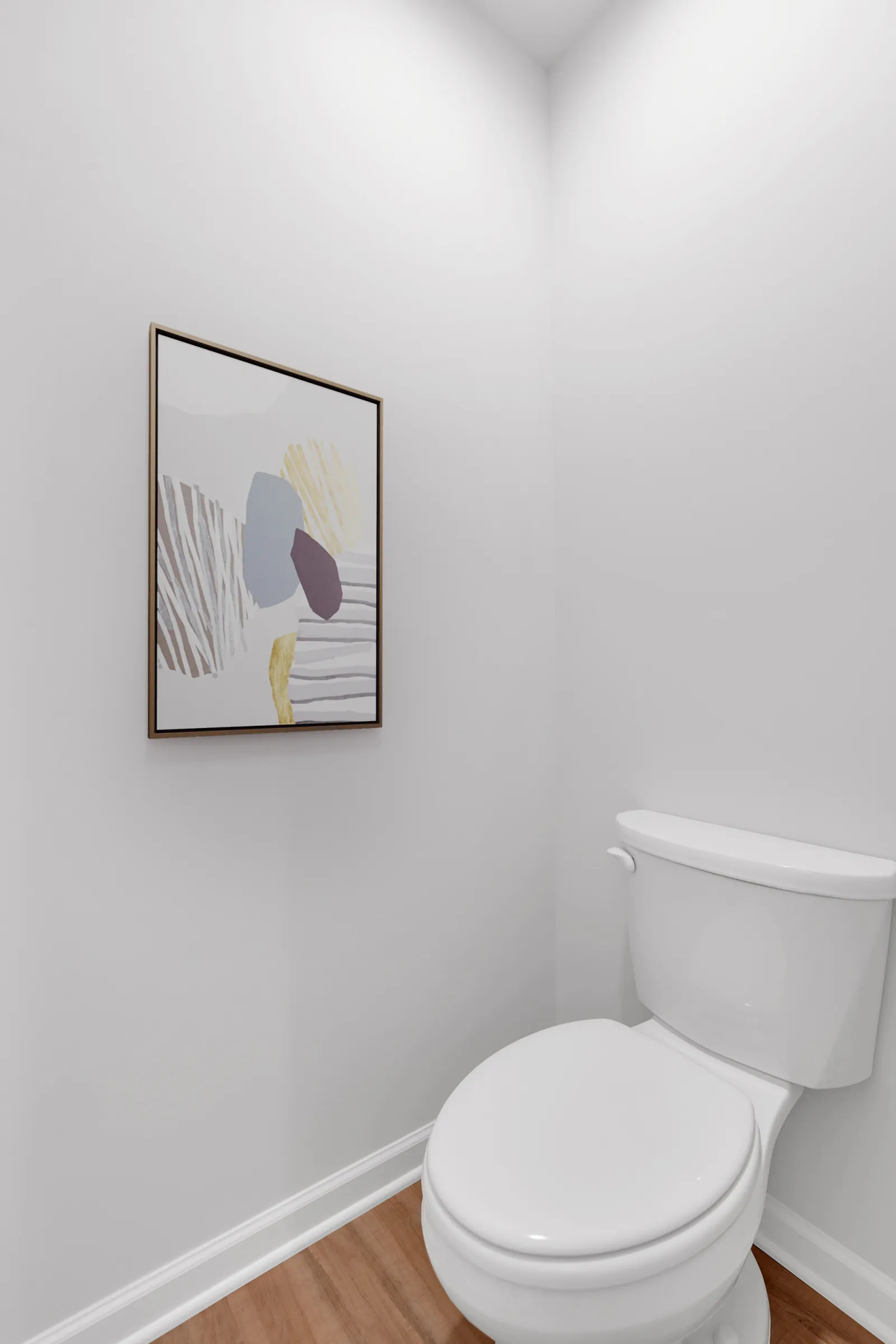 Minimalist white bathroom corner with a framed abstract artwork and a closed white toilet on wood floor.