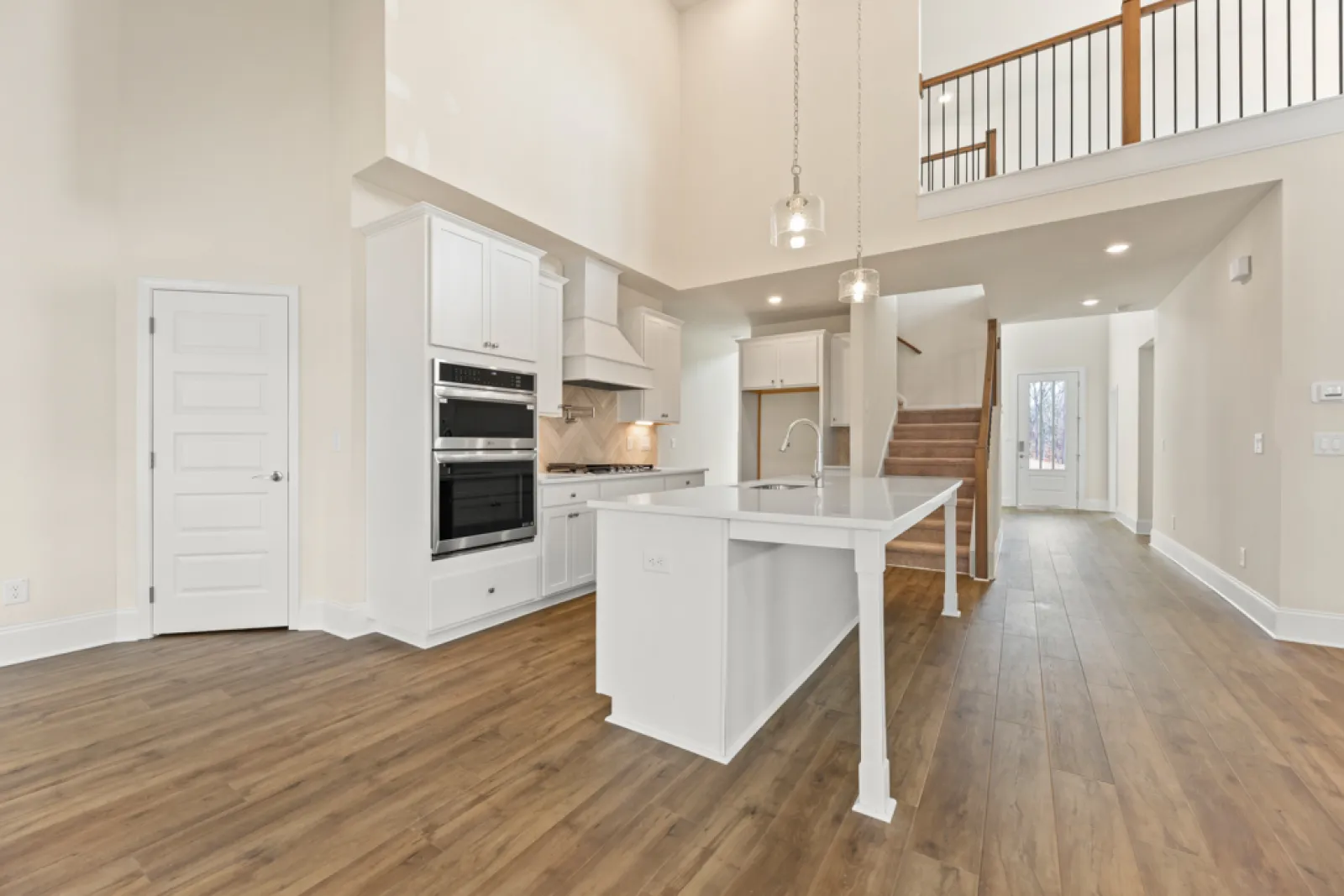 a kitchen with white cabinets