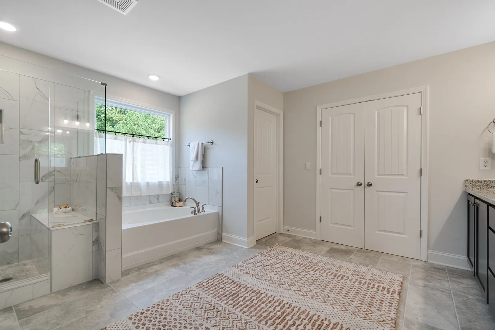a room with a sink and a mirror