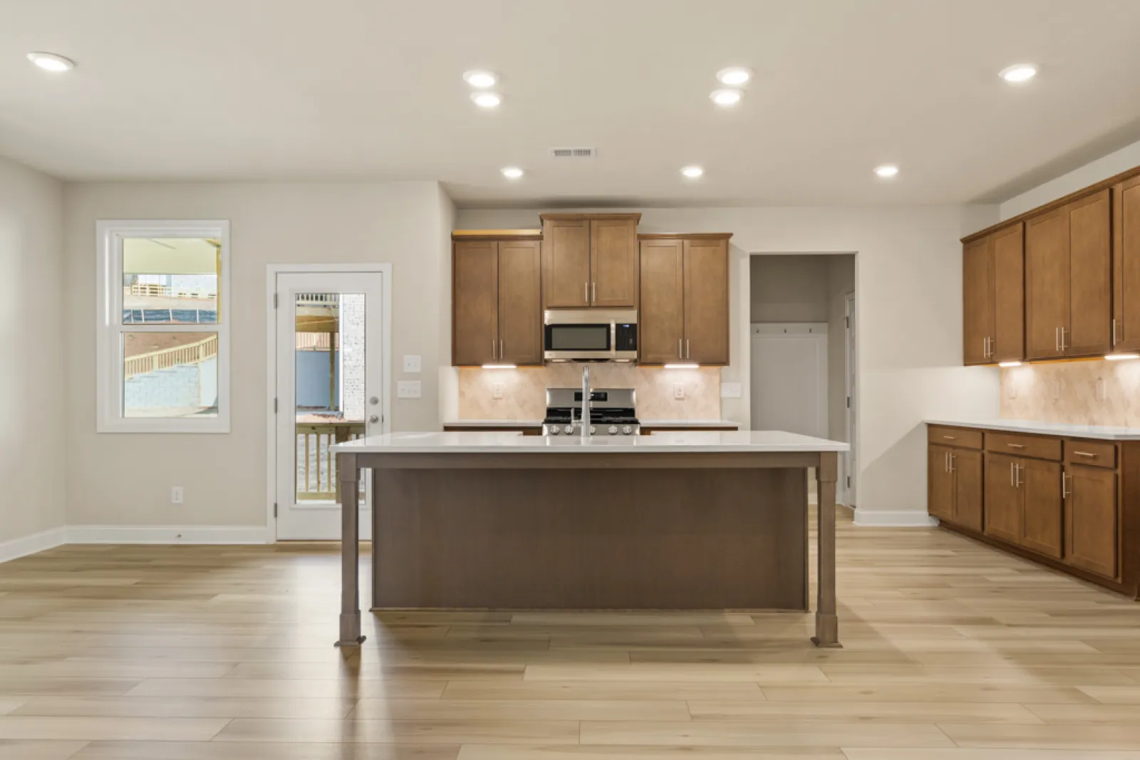 a kitchen with wooden cabinets