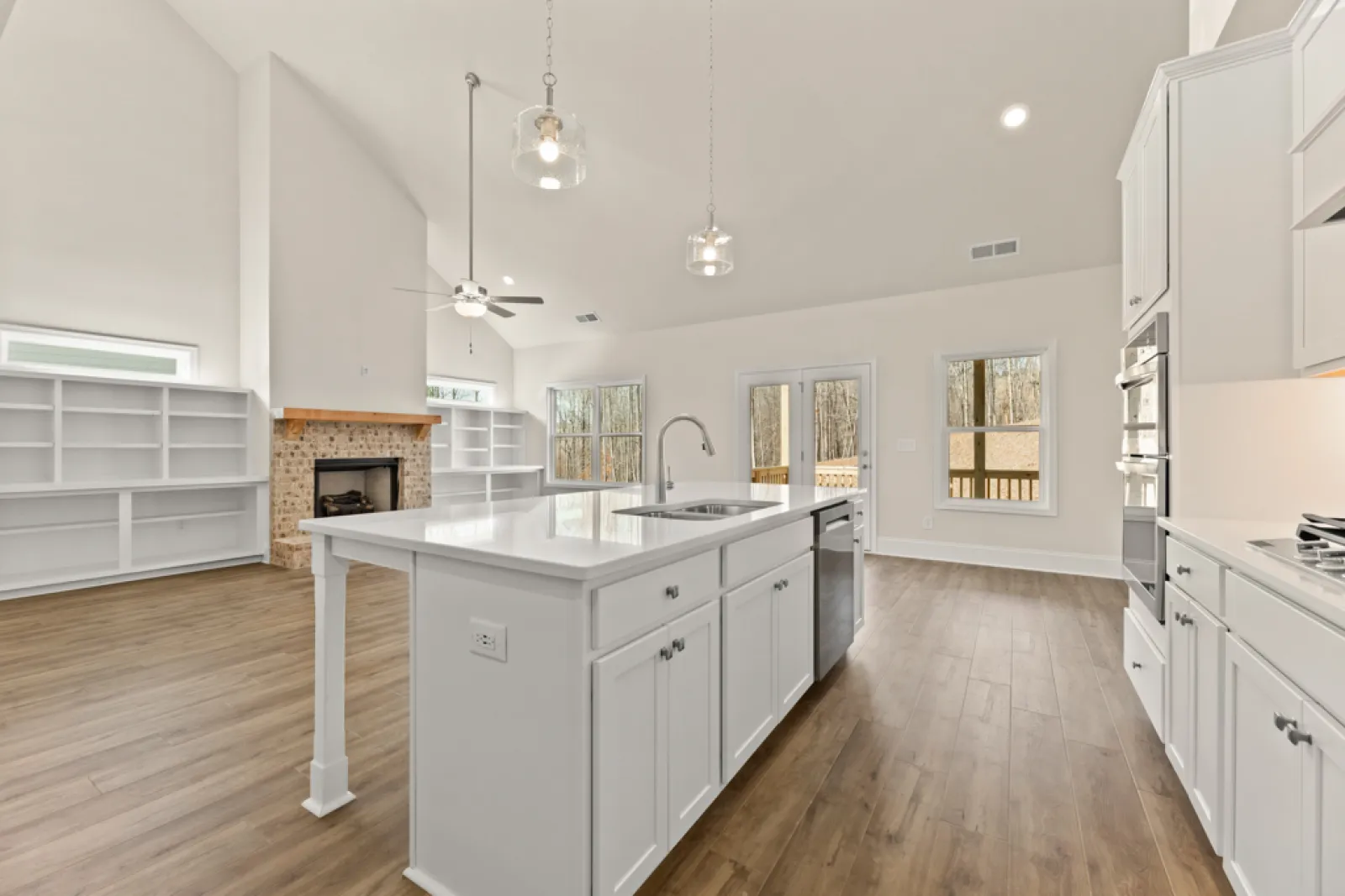 a kitchen with white cabinets