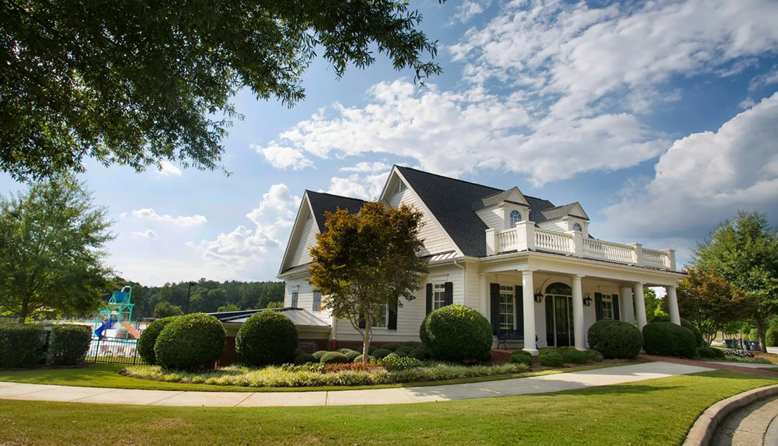 the clubhouse in front of the pool at The Georgian