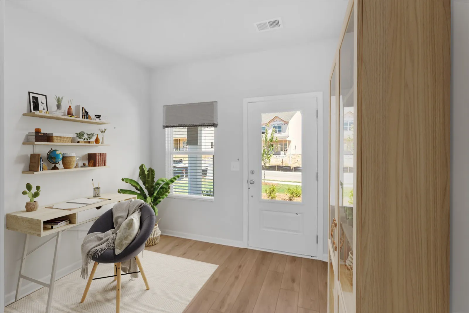 Bright modern home office with wooden desk, round chair, floating shelves, potted plants, and natural light.