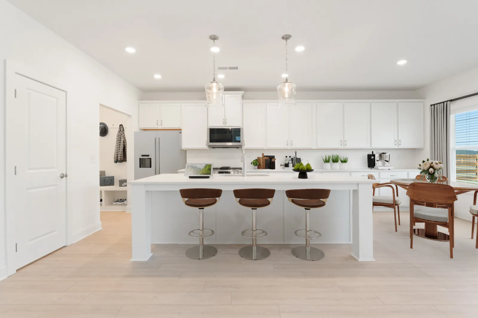 a kitchen with white cabinets