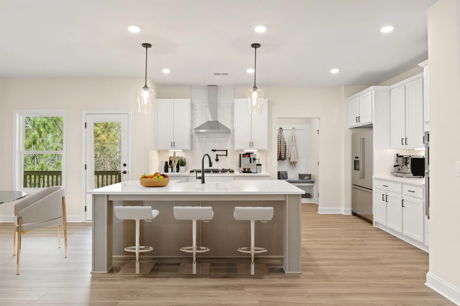 a kitchen with white cabinets