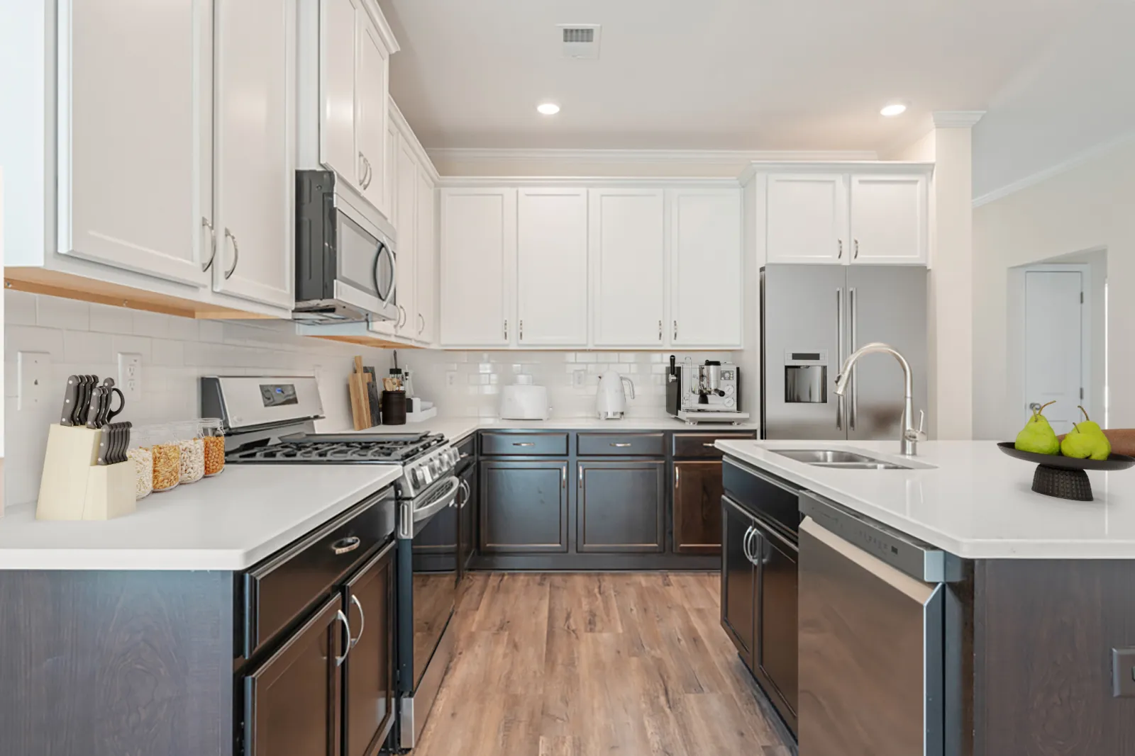 a kitchen with white cabinets