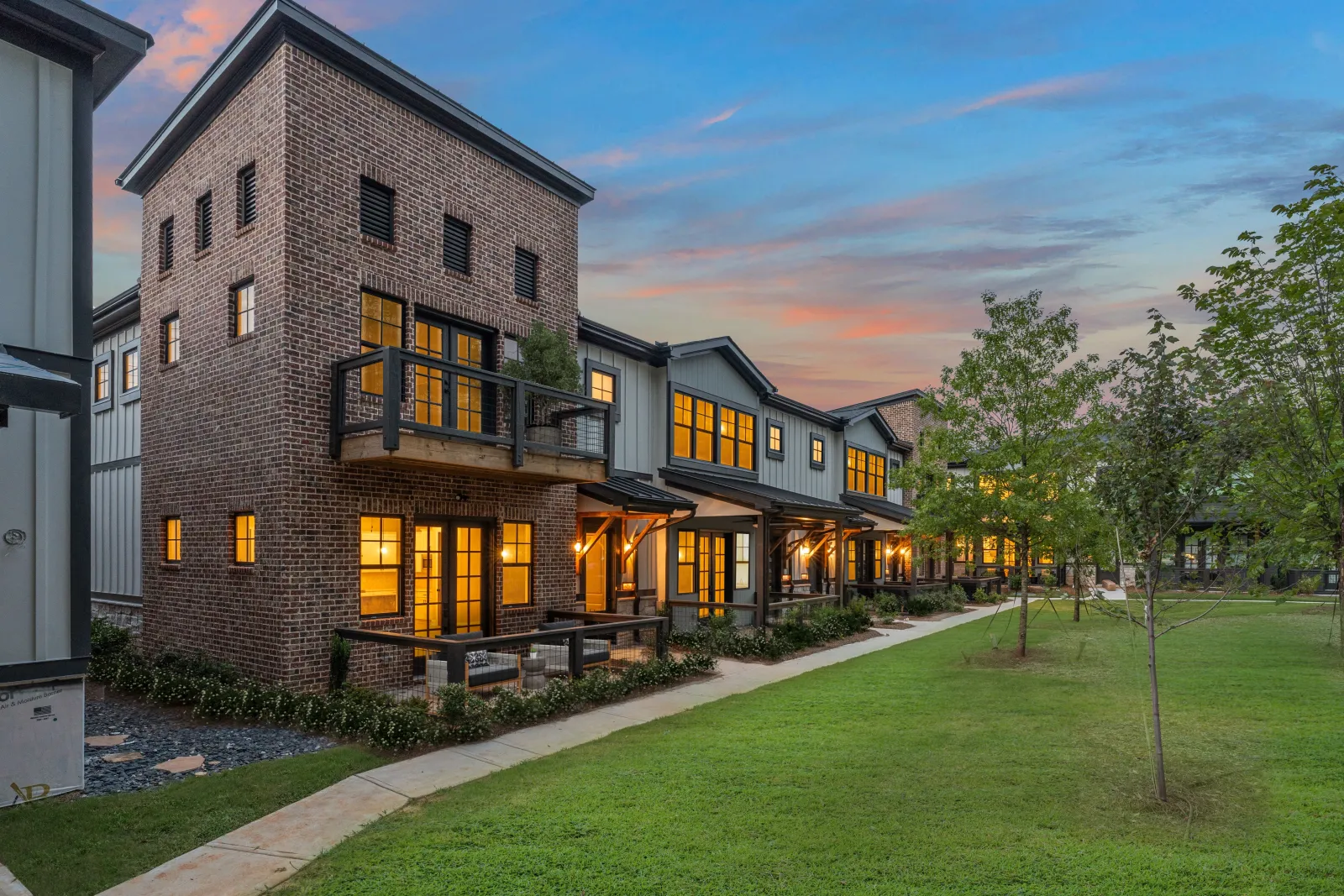 a building with a lawn and trees