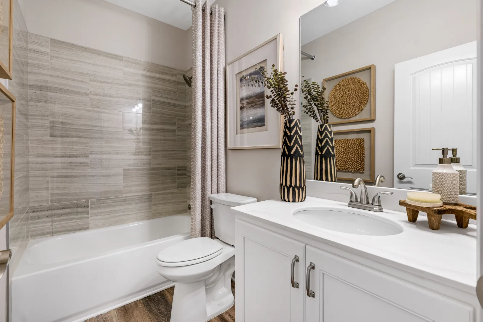 a bathroom with a tub sink and toilet