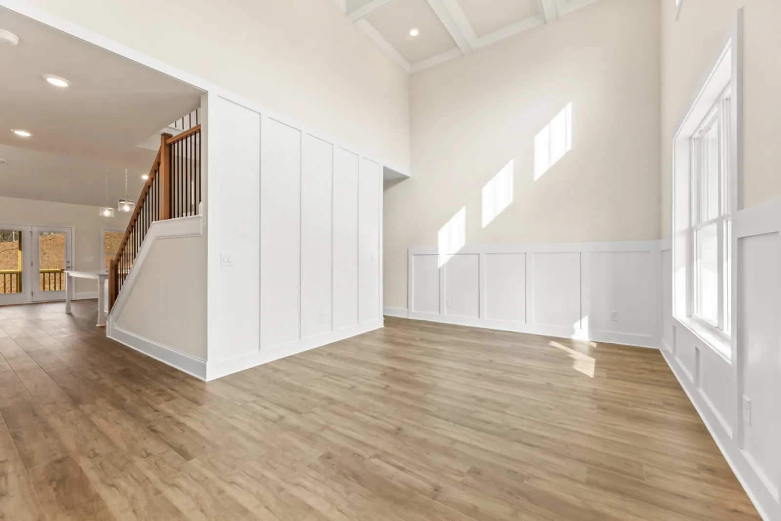 a room with white walls and wood floors