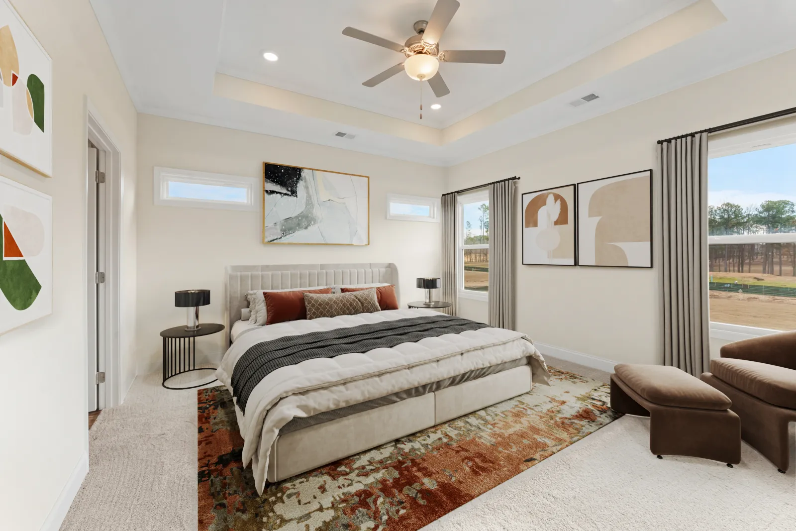 a bedroom with a large bed and a large window