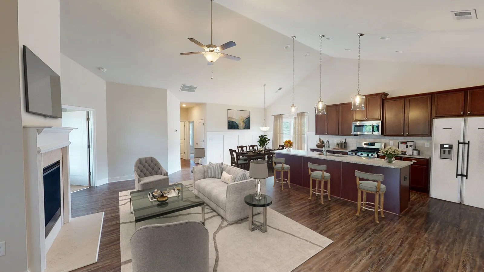 a large kitchen with a bar and a dining table