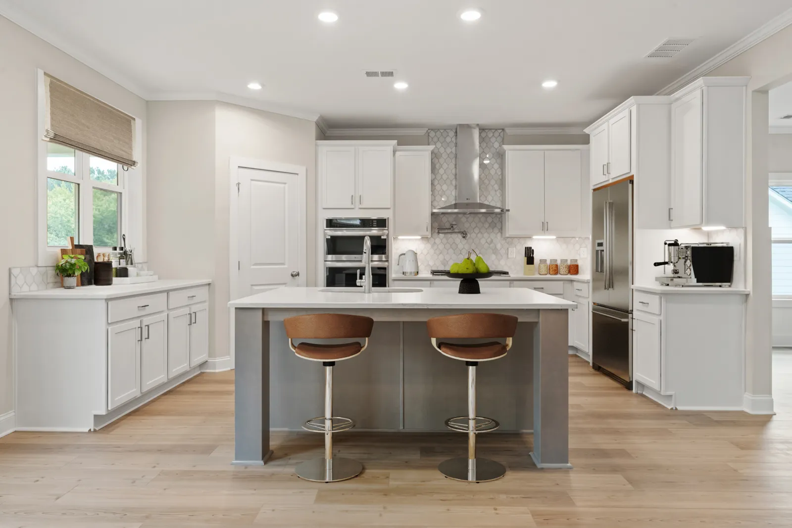 a kitchen with white cabinets