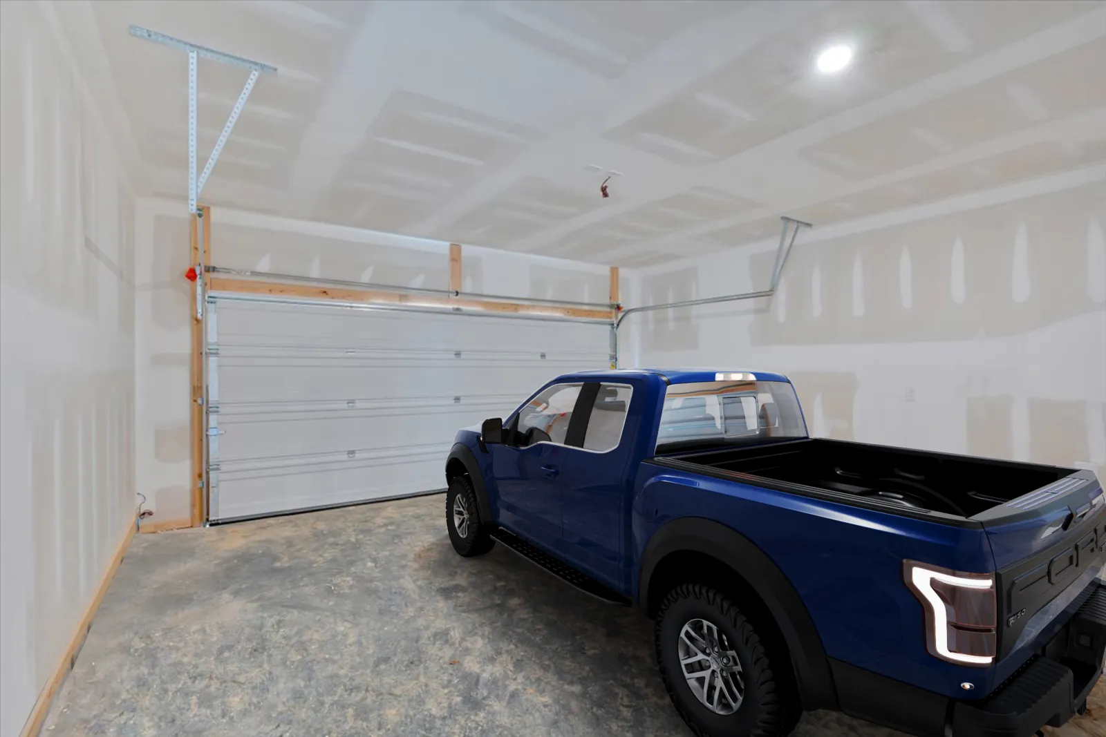 Blue pickup truck parked inside a spacious unfinished garage with white drywall and concrete floor.