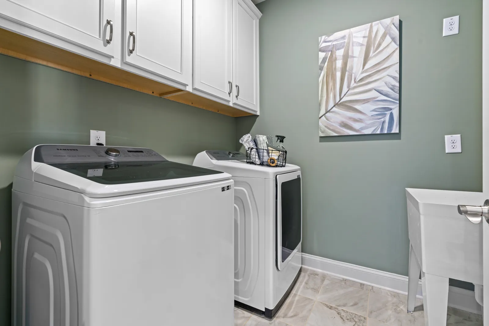 a kitchen with white cabinets