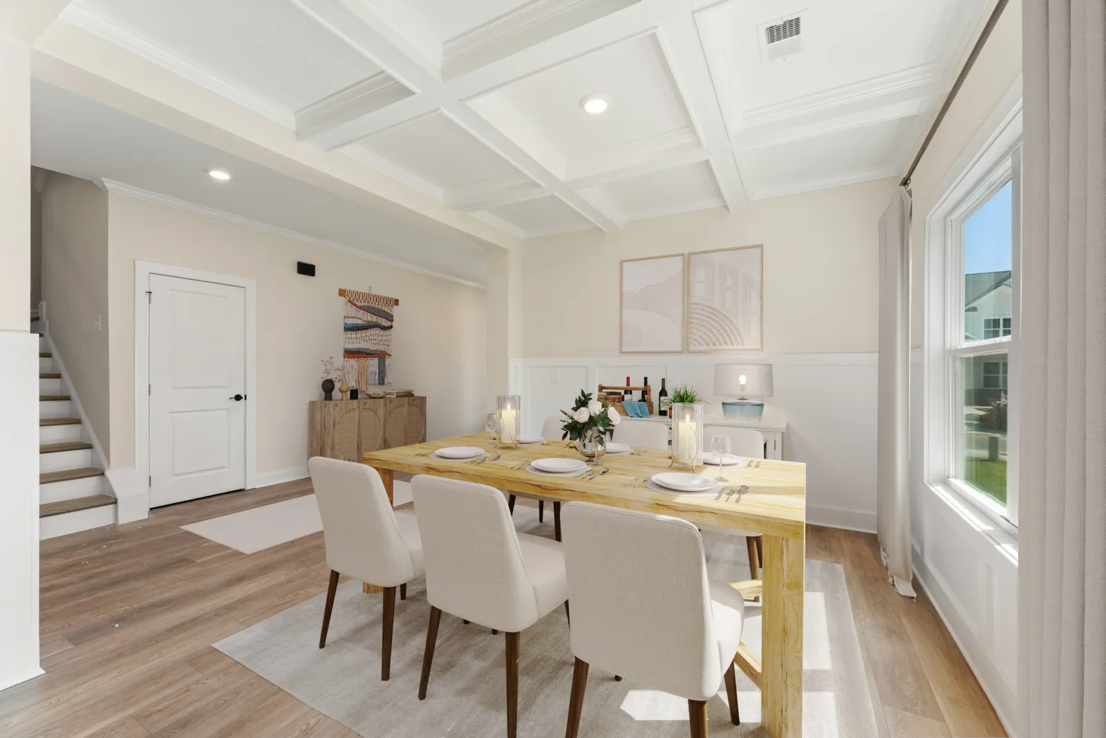 a dining room with white chairs