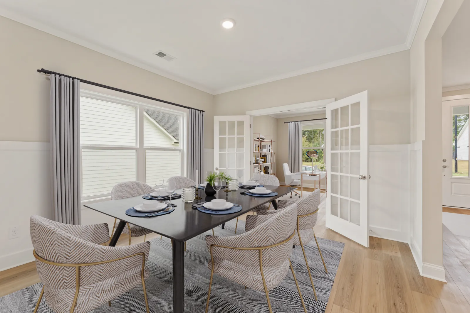 a dining room table with chairs