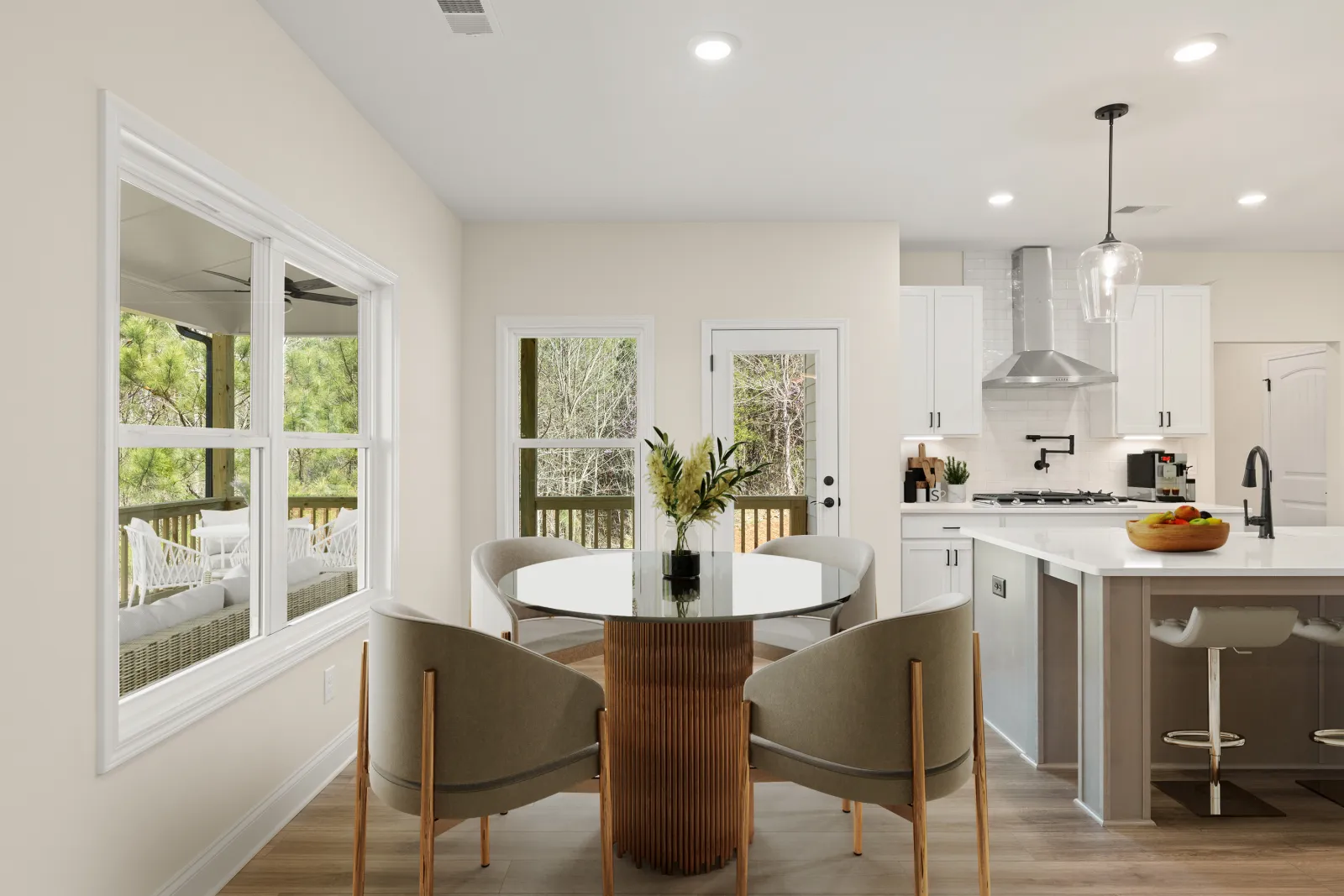 a kitchen with a table and chairs