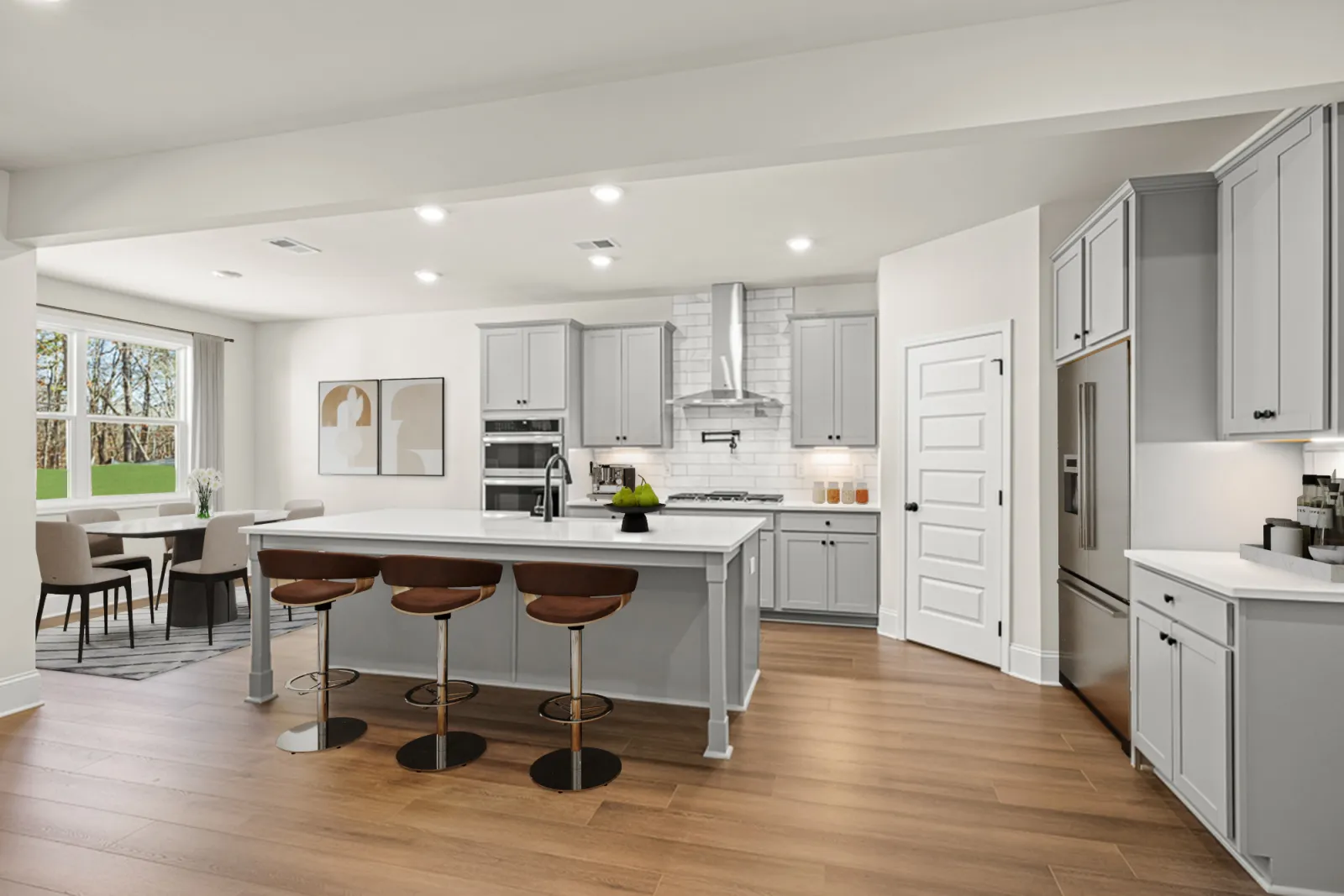 a kitchen with white cabinets