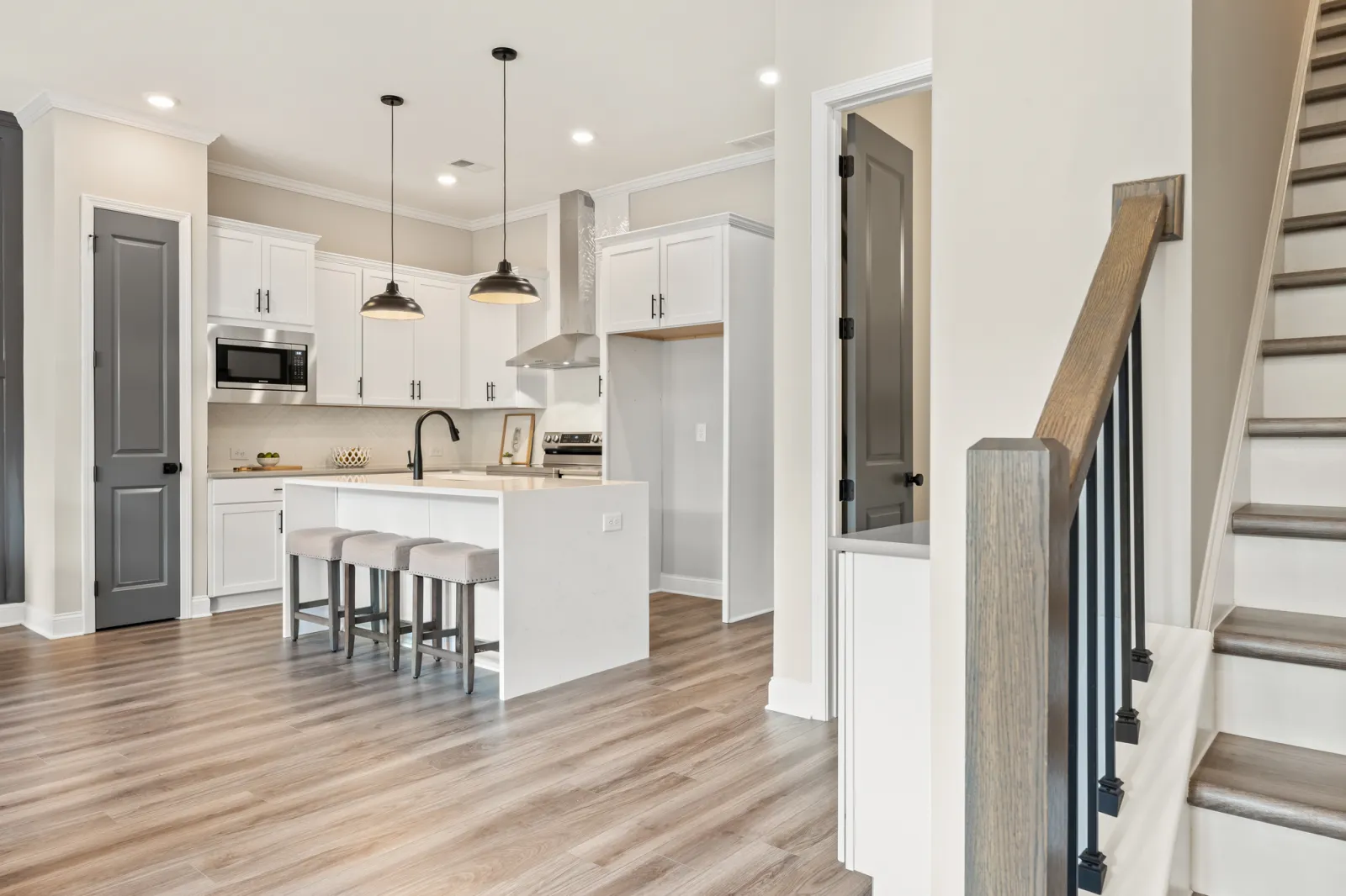 a kitchen with white cabinets