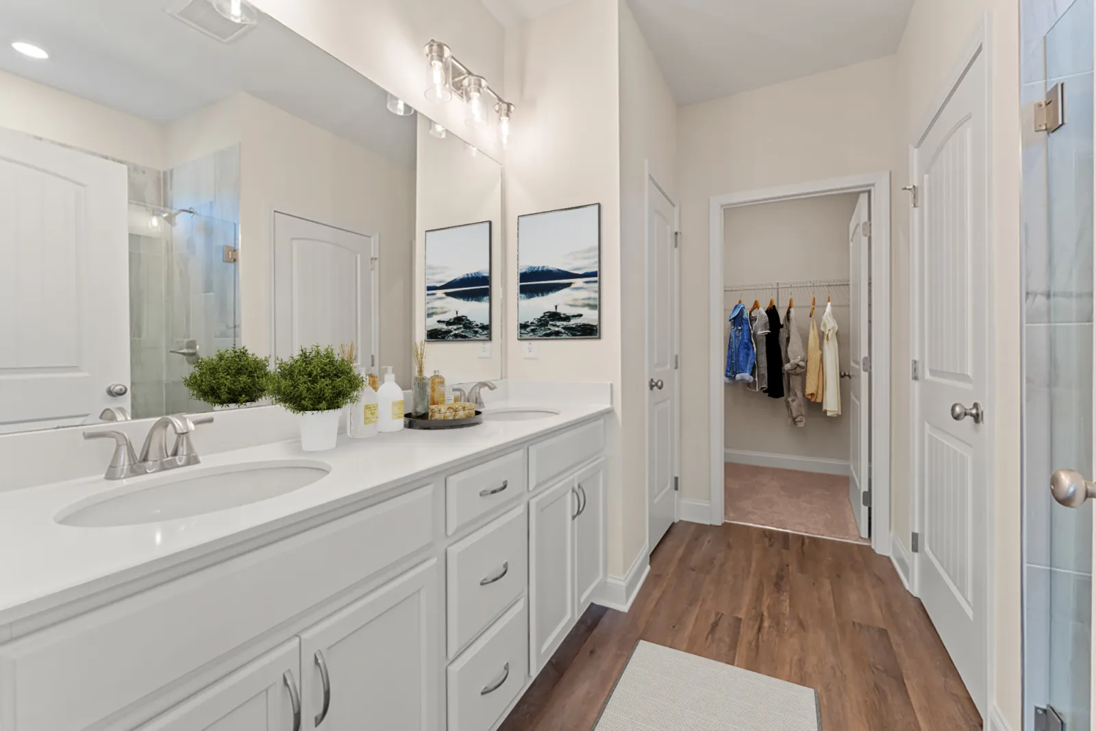 a bathroom with white cabinets