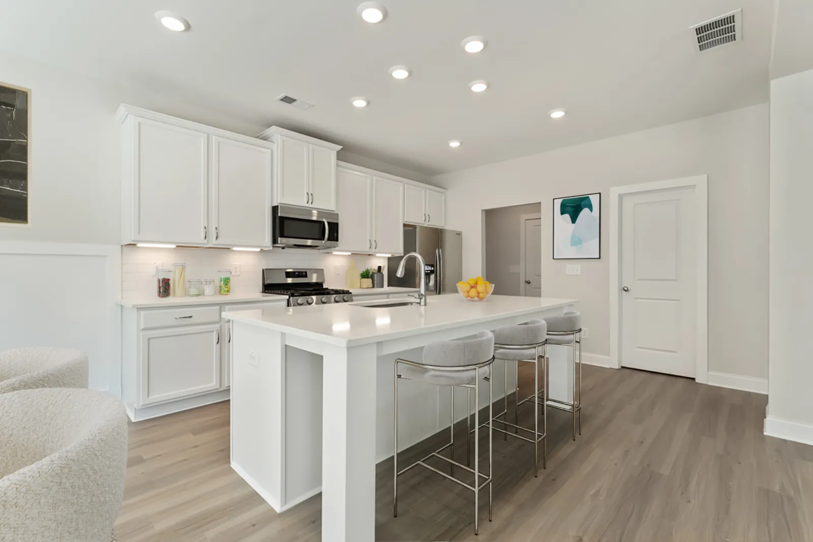 a kitchen with white cabinets