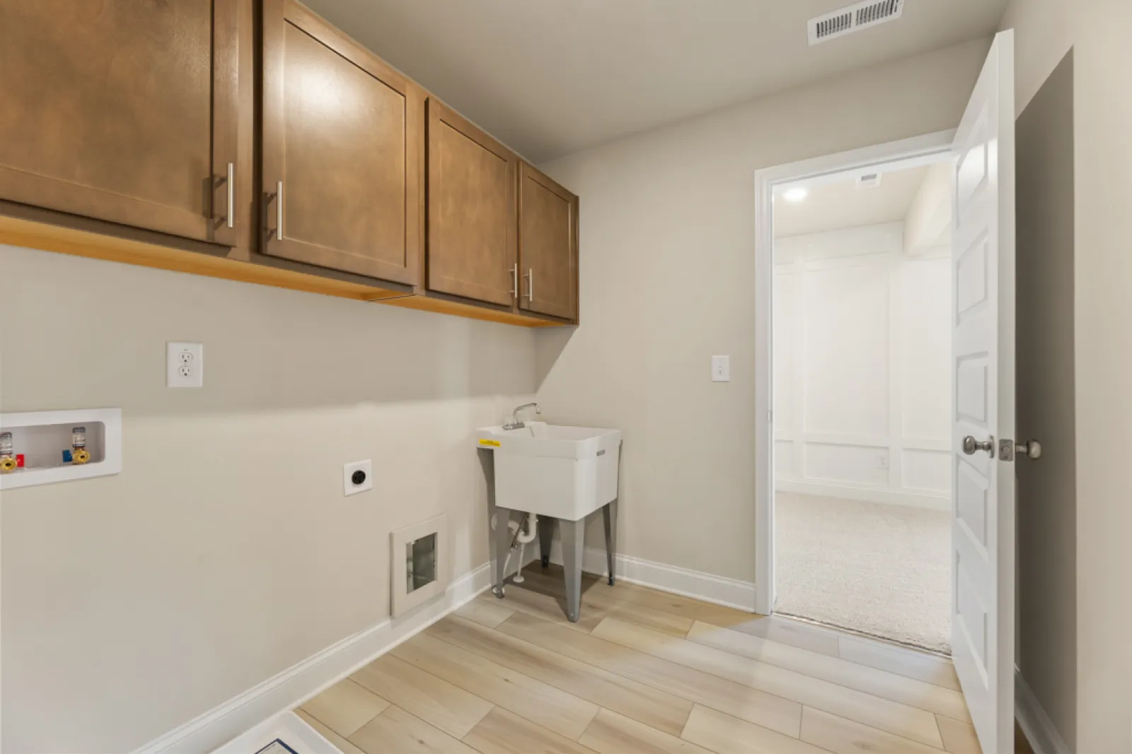 a bathroom with wooden cabinets