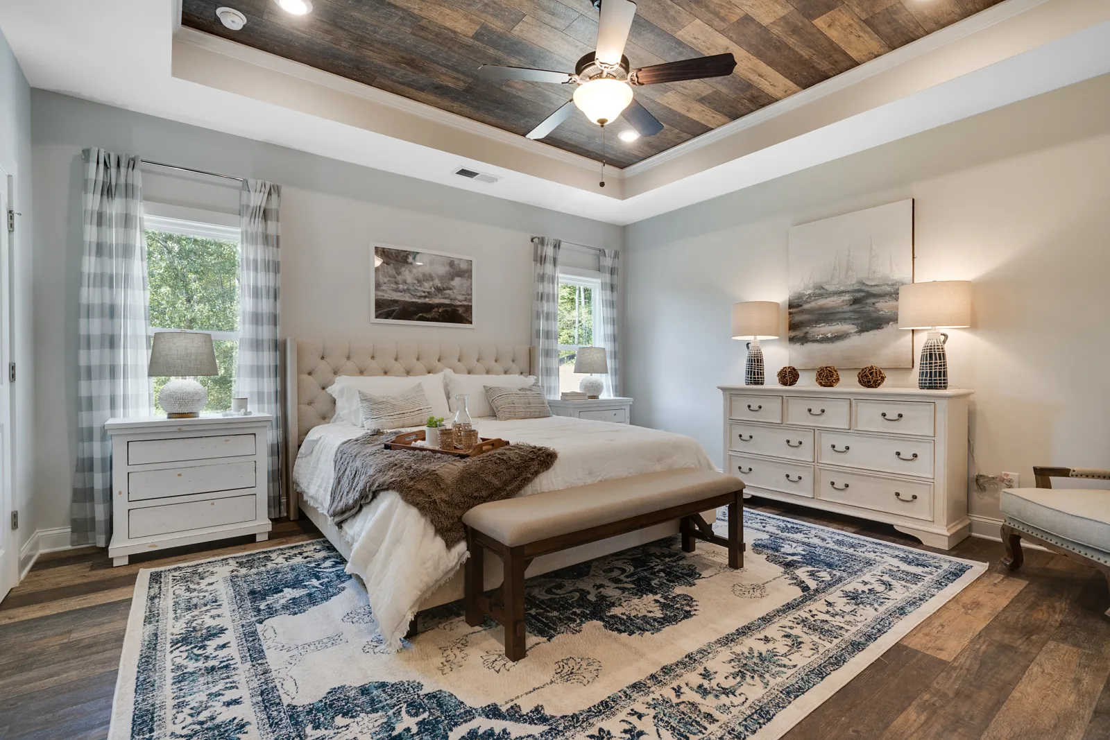 a bedroom with a bed and a fan