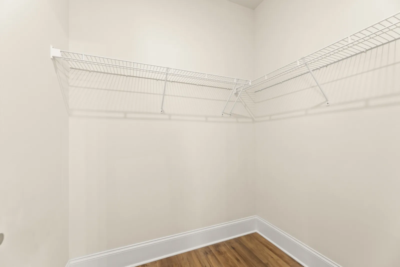 a white wall with a vent