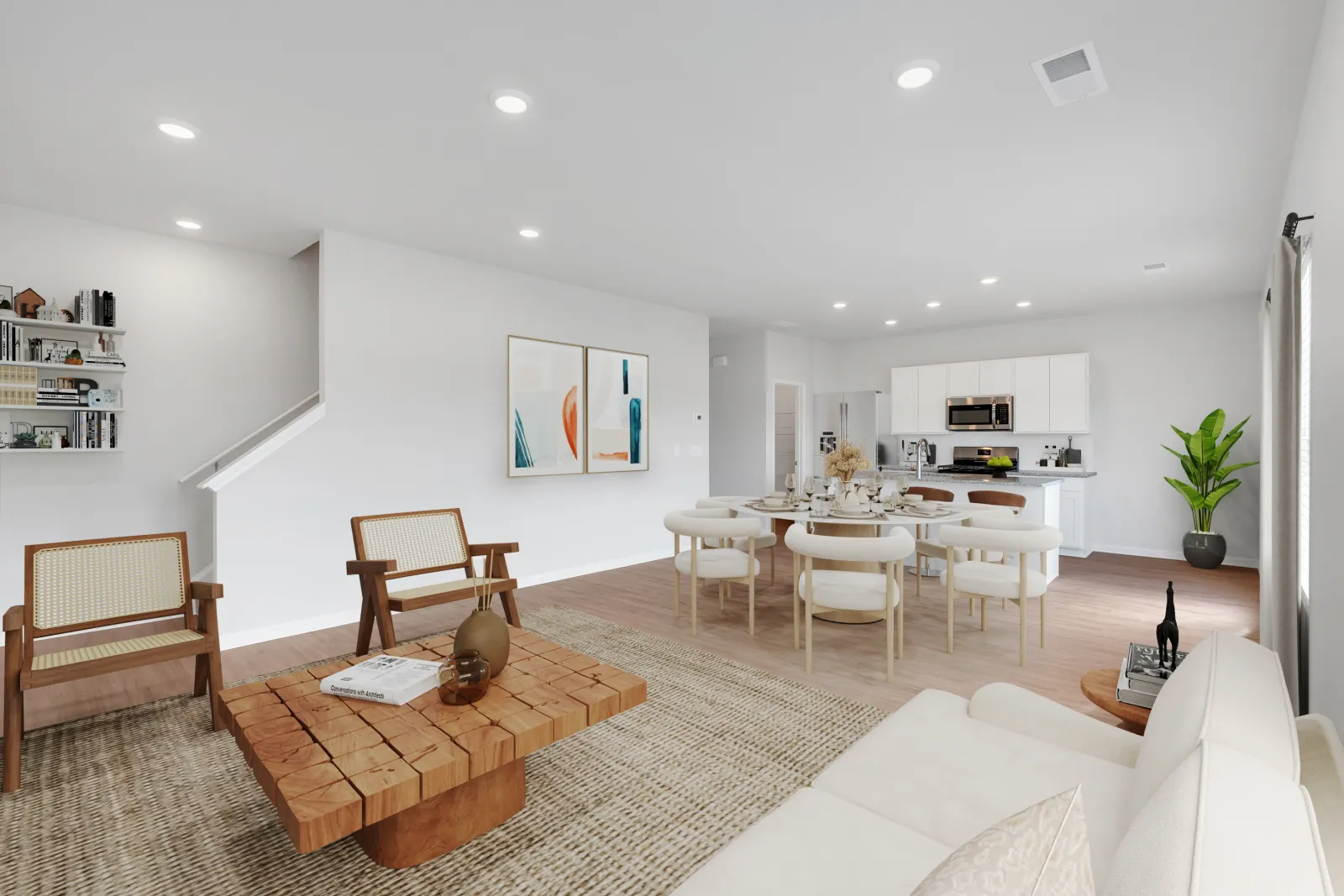 Modern open-plan living and dining area with neutral tones, wooden furniture, and contemporary kitchen in the background