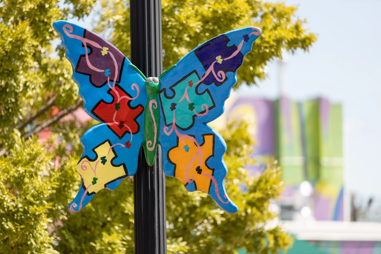 a couple of butterflies on a pole