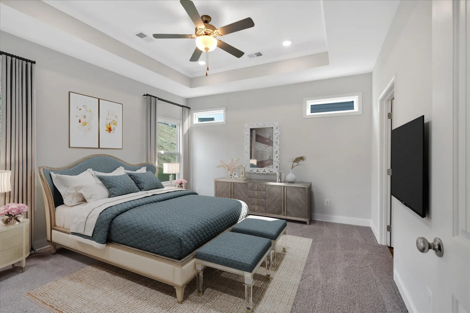 Modern bedroom with a queen bed, blue bedding, twin benches, dresser, and ceiling fan with light.