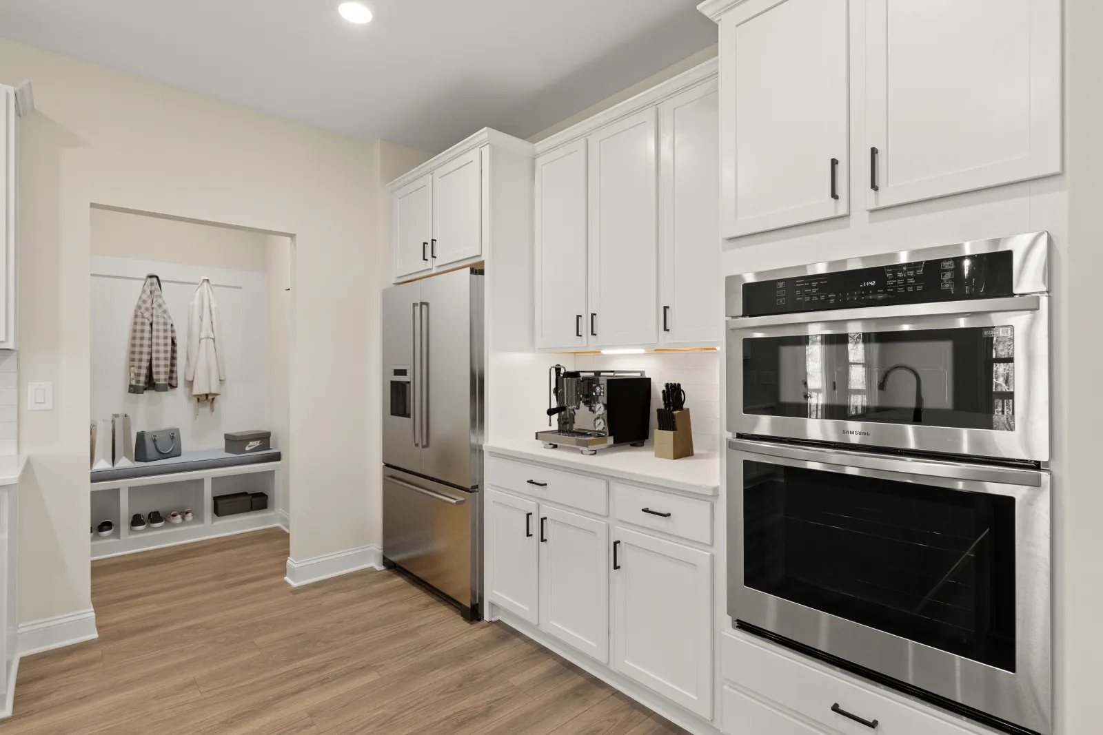 a kitchen with white cabinets