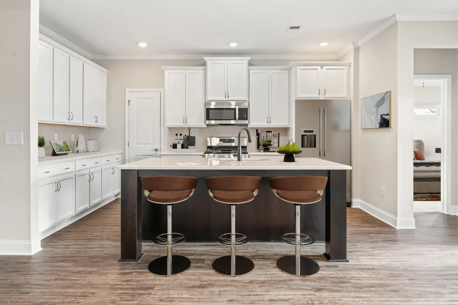 a kitchen with white cabinets