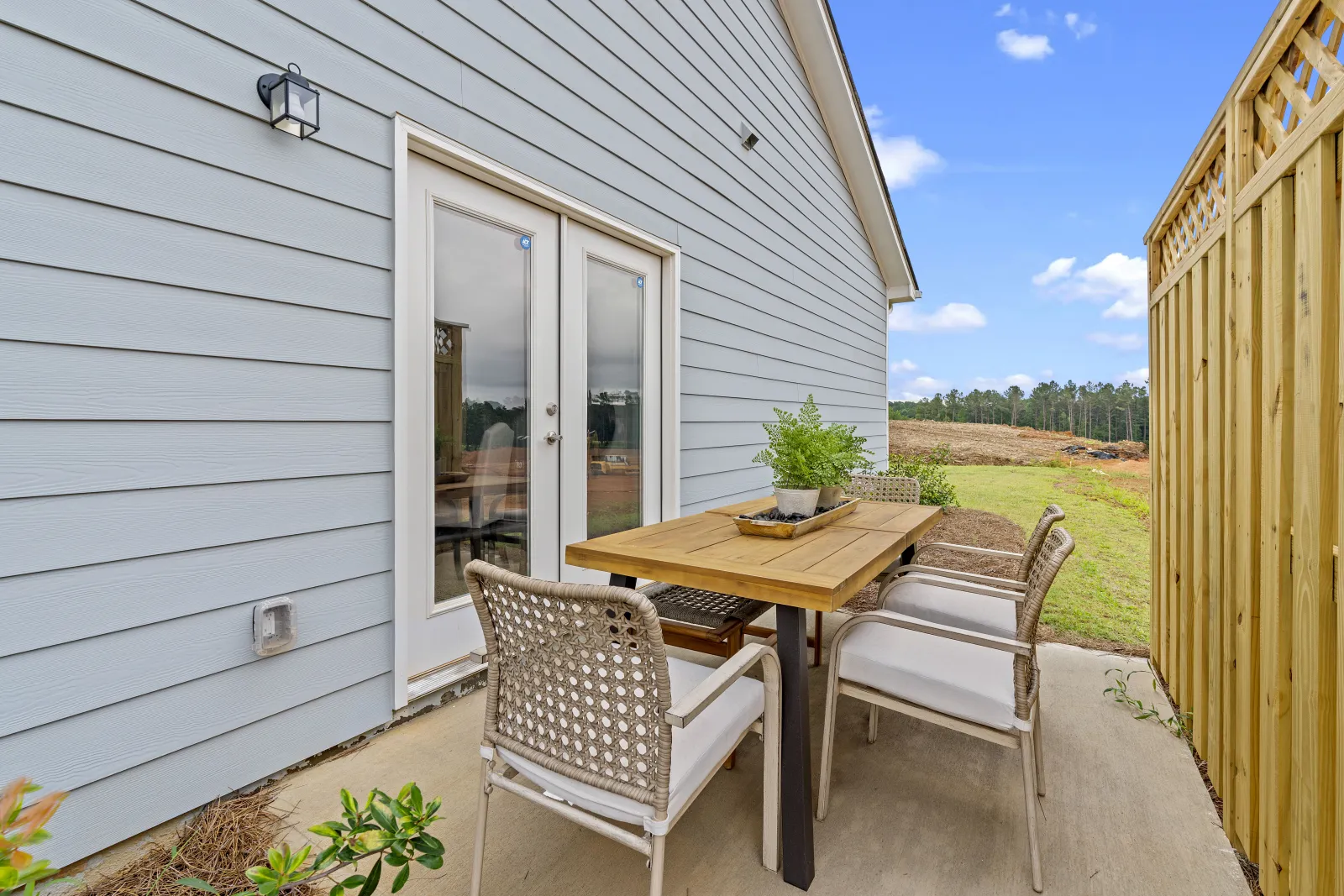 a table and chairs outside a house