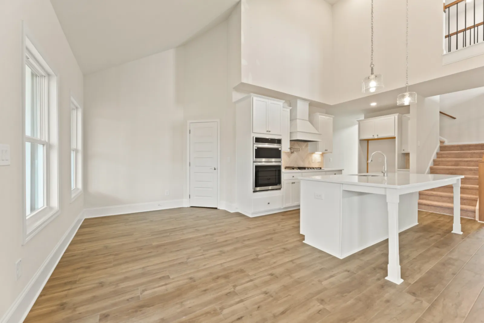 a kitchen with white cabinets