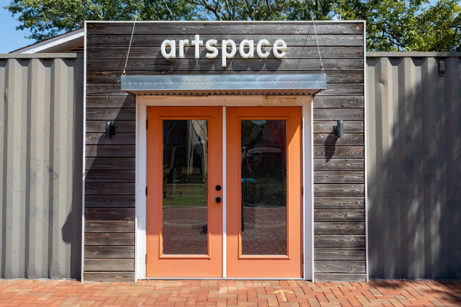 a wood building with a large door