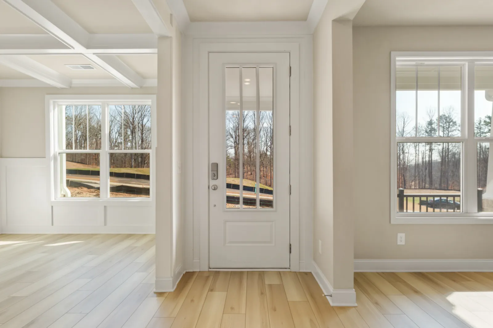 a room with windows and a wood floor