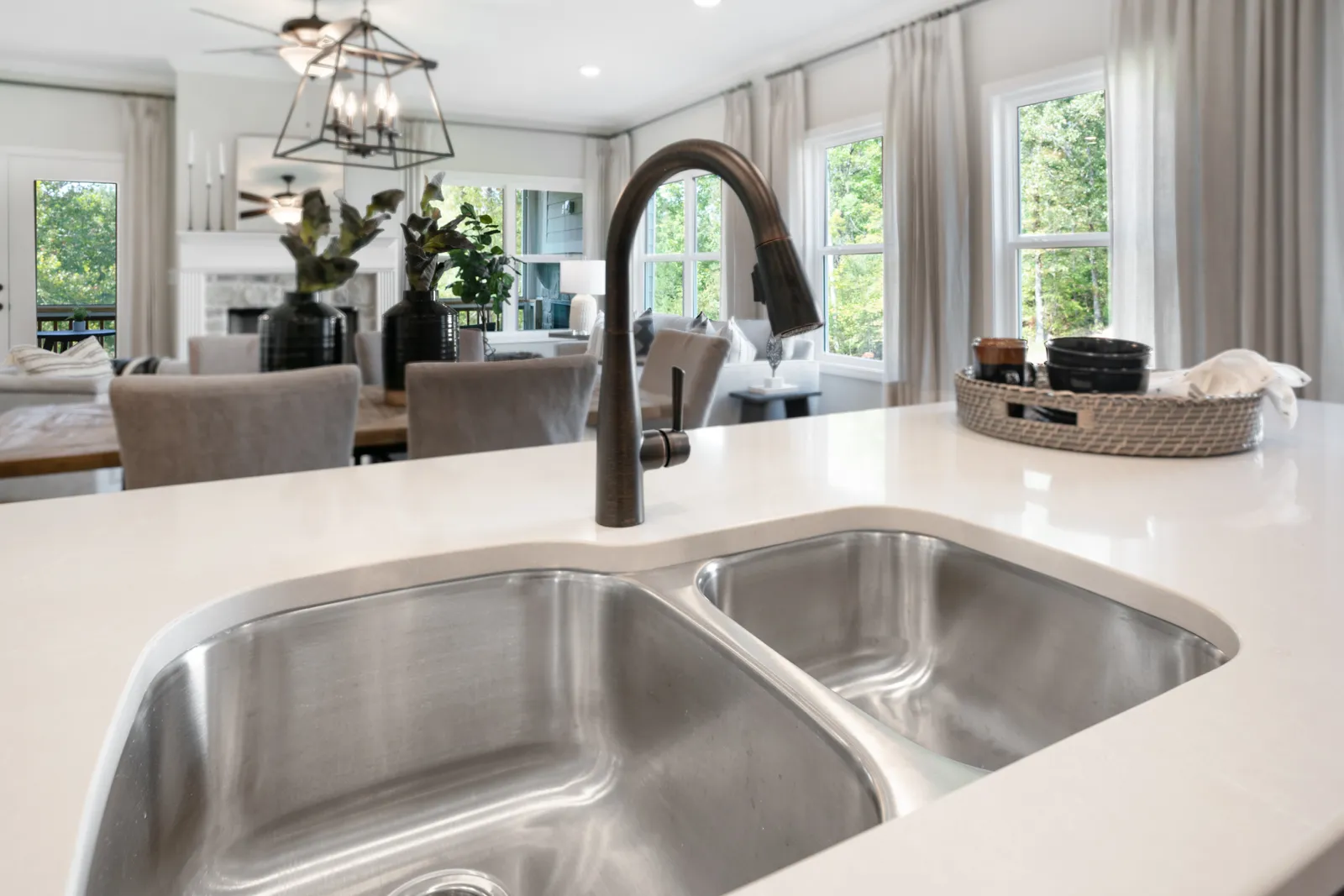 a kitchen with a sink and a white tub sitting next to a window