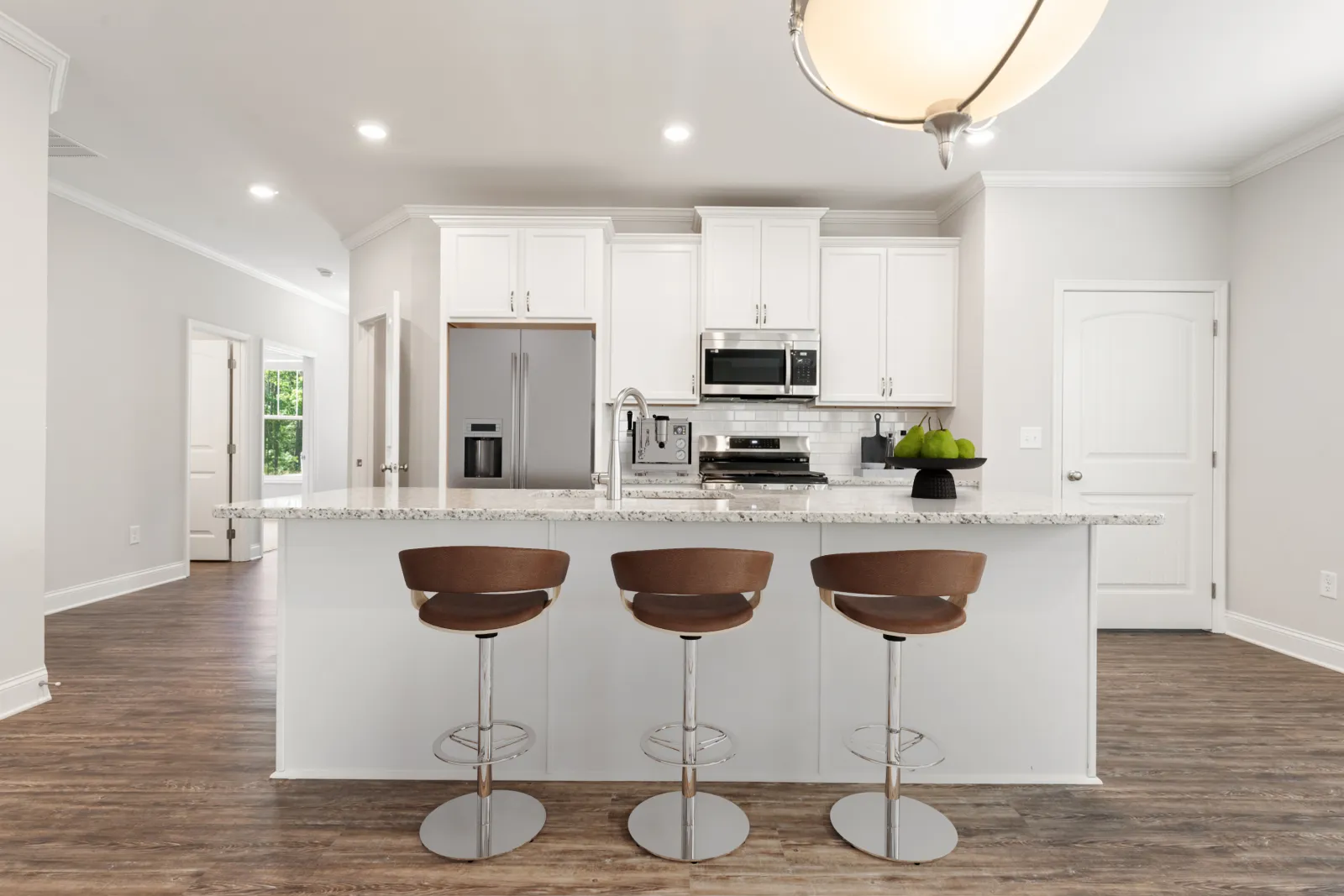 a kitchen with white cabinets