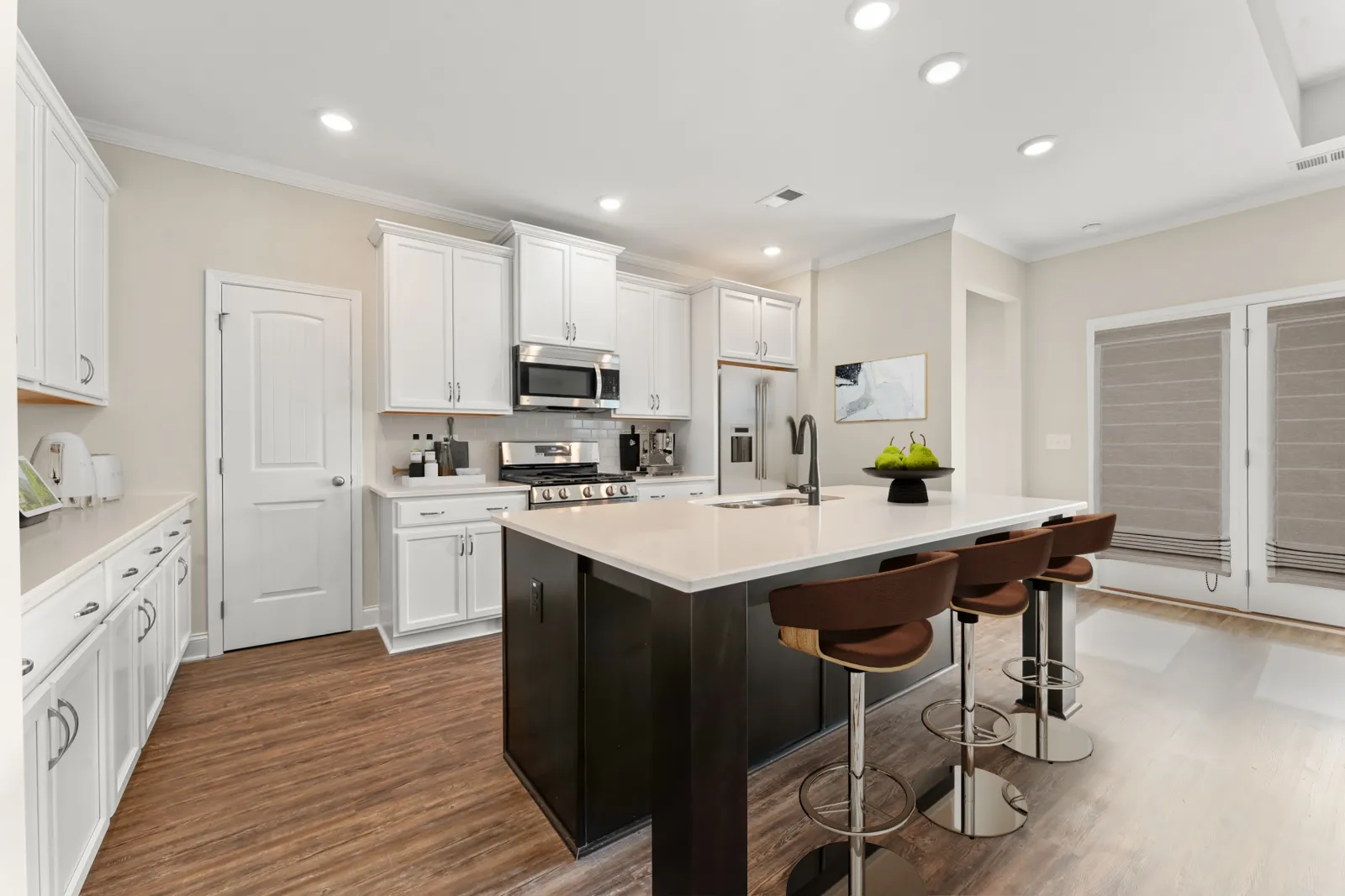 a kitchen with white cabinets