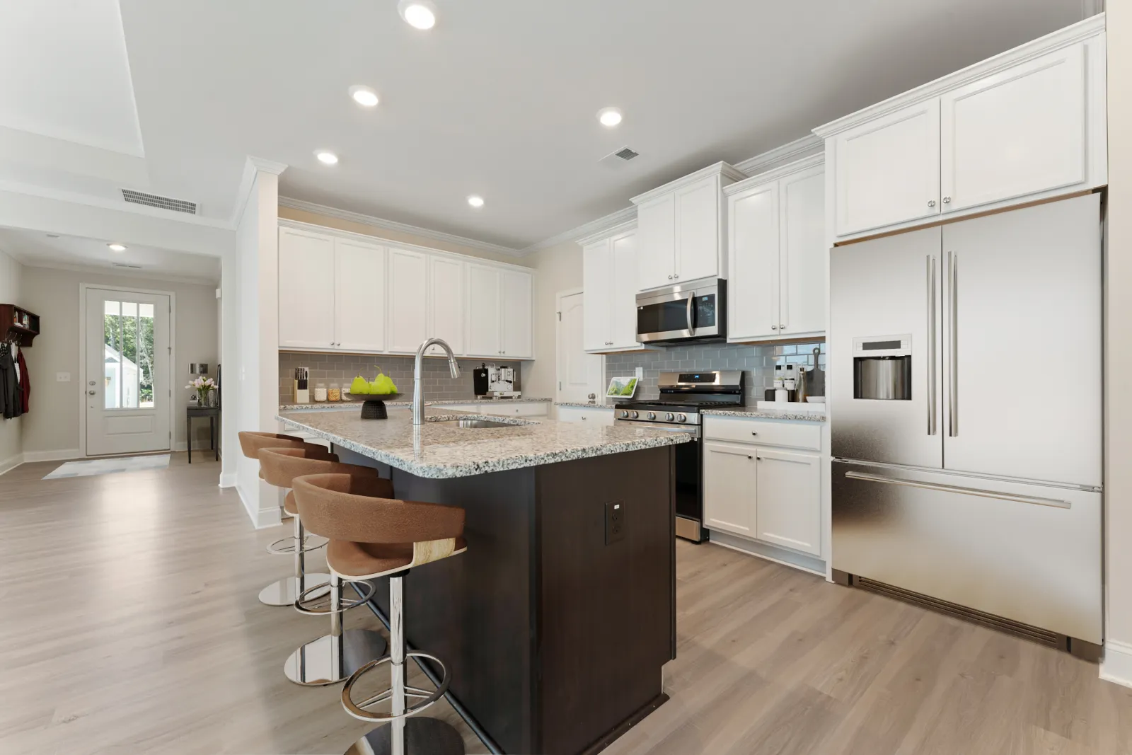 a kitchen with white cabinets