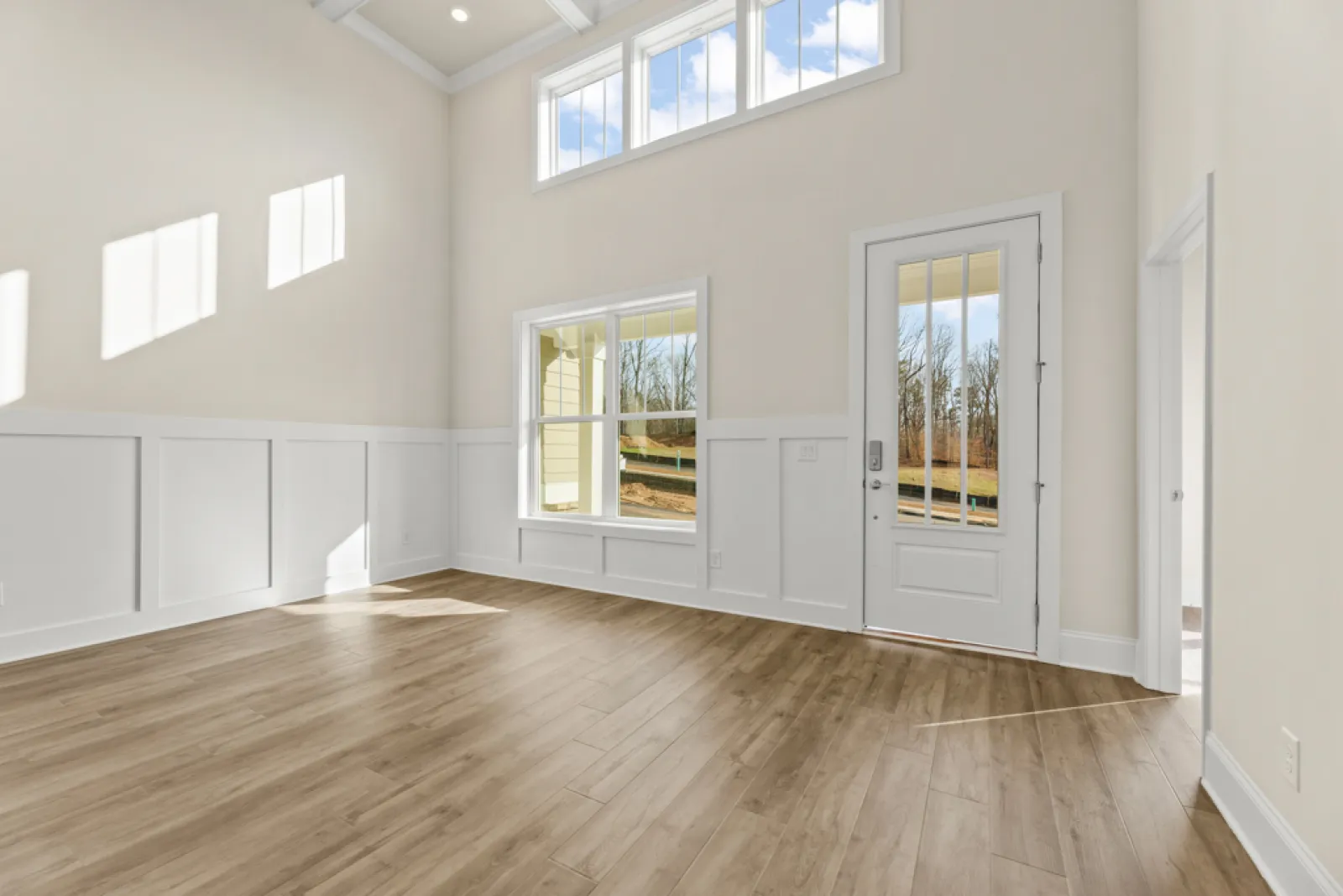 a room with white walls and windows